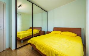 Postel nebo postele na pokoji v ubytování Adria Apartments