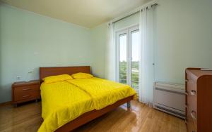Postel nebo postele na pokoji v ubytování Adria Apartments