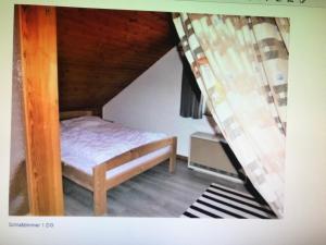 Un pat sau paturi într-o cameră la Ferienhaus Sauerlandtraum