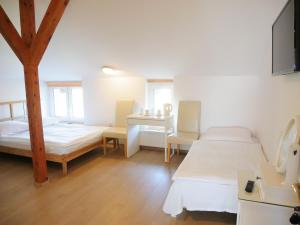 Łóżko lub łóżka w pokoju w obiekcie Słoneczny Dom pokoje i apartament na wynajem