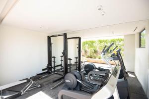 a gym with cardio equipment in a house at Dream Villa Corossol 706 in Saint Barthelemy