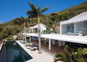 an external view of a house with a swimming pool at Dream Villa Corossol 643 in Gustavia