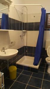 a bathroom with a sink and a shower and a toilet at Apartmani Lovre Posedarje in Posedarje +50 photos