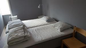 
Säng eller sängar i ett rum på Rutsbrogården
