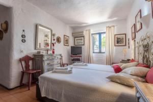 Un pat sau paturi într-o cameră la Villa Morena