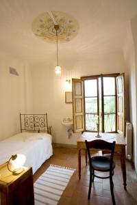 A bed or beds in a room at Locanda Casanuova
