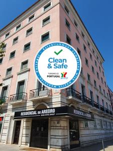 a building with a sign for a green and safe hospital at Residencial do Areeiro in Lisbon