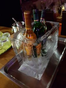 three bottles in an ice bucket on a table at Müllner-Hof in Schwarzach bei Nabburg