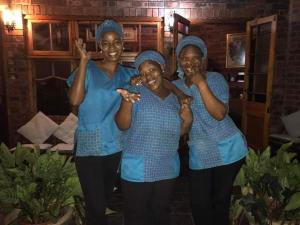 three women in blue scrubs posing for a picture at Wendy's Country Lodge in Mtubatuba