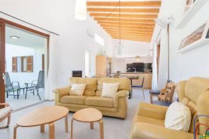 a living room with a couch and tables at Amedart in Alcudia