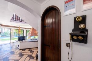 a door in a room with a living room at RENT4REST Sesimbra 4Bdr Ocean View and Private Pool Villa in Sesimbra