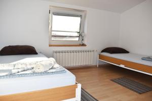 Postel nebo postele na pokoji v ubytování Rooms Busija