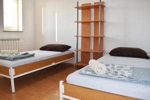 Postel nebo postele na pokoji v ubytování Rooms Busija