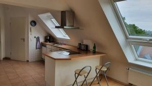 Kuchyň nebo kuchyňský kout v ubytování Ferienwohnung mit See- und Waldblick + 2 fotografie