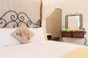 A bed or beds in a room at Hometown B&B