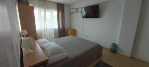 Postel nebo postele na pokoji v ubytování Vila Rocco