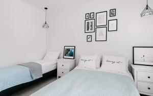 Łóżko lub łóżka w pokoju w obiekcie SeaSide Apartment