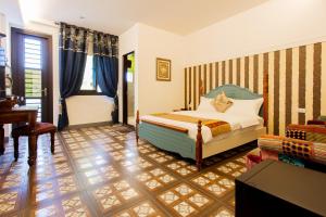 A bed or beds in a room at Hometown B&B