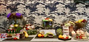 a table filled with different types of fruits and vegetables at Libarty Hotels in Weinstadt