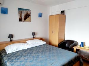 Postel nebo postele na pokoji v ubytování Vila Rocco