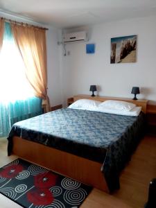 Postel nebo postele na pokoji v ubytování Vila Rocco
