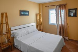 Кровать или кровати в номере CASA LA ISLETA PLAYA