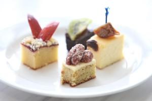 four different types of desserts on a white plate at Dorsett Grand Labuan in Labuan