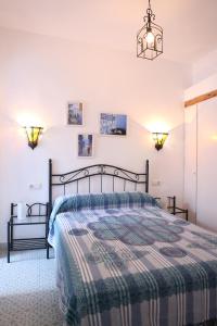 Ένα ή περισσότερα κρεβάτια σε δωμάτιο στο Vivienda de Alojamiento Rural Casa Naty