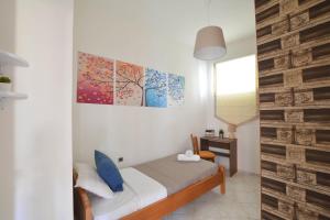 Ένα ή περισσότερα κρεβάτια σε δωμάτιο στο Oasis Residence