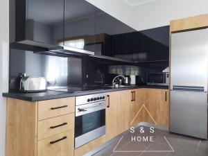 Kuchyň nebo kuchyňský kout v ubytování S&S Home
