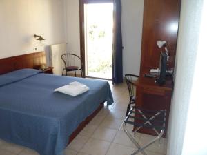 Postel nebo postele na pokoji v ubytování Hotel L'Ancora