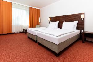 Postel nebo postele na pokoji v ubytování Hotel Euro + 21 fotografií