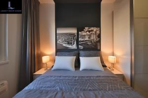 Postel nebo postele na pokoji v ubytování Legacy Marine2 - Zadar, Luxury Suites