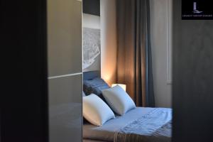 Postel nebo postele na pokoji v ubytování Legacy Marine2 - Zadar, Luxury Suites
