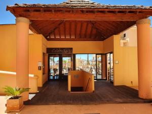 an entrance to a building with a wooden deck at Praia da Luz Monique Apartment in Luz