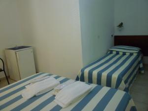 Postel nebo postele na pokoji v ubytování Hotel L'Ancora