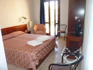 En eller flere senger på et rom på Hotel L'Ancora