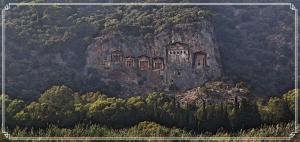 an old building on the side of a mountain at Myra Hotel in Dalyan