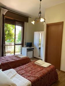 Un pat sau paturi într-o cameră la B&B Santa Monica