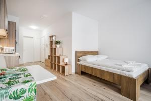 Postel nebo postele na pokoji v ubytování BpR Brody Street Home