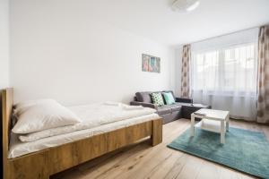 Postel nebo postele na pokoji v ubytování BpR Brody Street Home