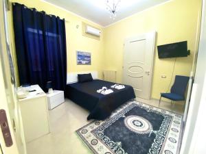 TV a/nebo společenská místnost v ubytování B&B Smeraldo