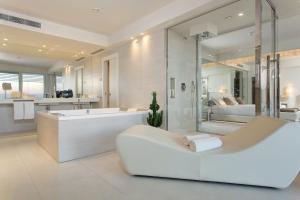 a large bathroom with a tub and a shower at Almar Jesolo Resort & Spa in Lido di Jesolo