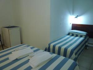 Postel nebo postele na pokoji v ubytování Hotel L'Ancora