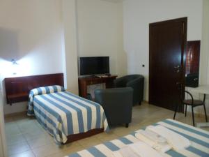 Postel nebo postele na pokoji v ubytování Hotel L'Ancora