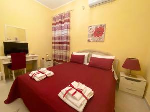 Postel nebo postele na pokoji v ubytování B&B Smeraldo