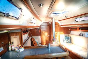 a kitchen with a sink in the middle of a boat at Segelyacht Bremen City in Bremen