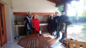 people standing around a kitchen at Posada Cavieres Wine Farm in Maipú