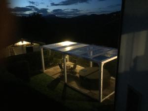 a night view of a patio with lights on it at Villa Tamara Country & Spa Suites in Montefiore Conca