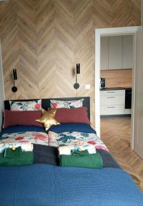 Posteľ alebo postele v izbe v ubytovaní Apartament 53 Długie Ogrody Gdańsk